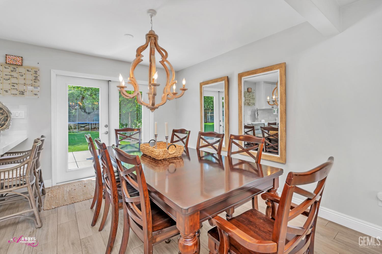 Undisclosed Address Bakersfield, CA 93309 - Photo 6 of 30 a dining room with furniture a chandelier and wooden floor