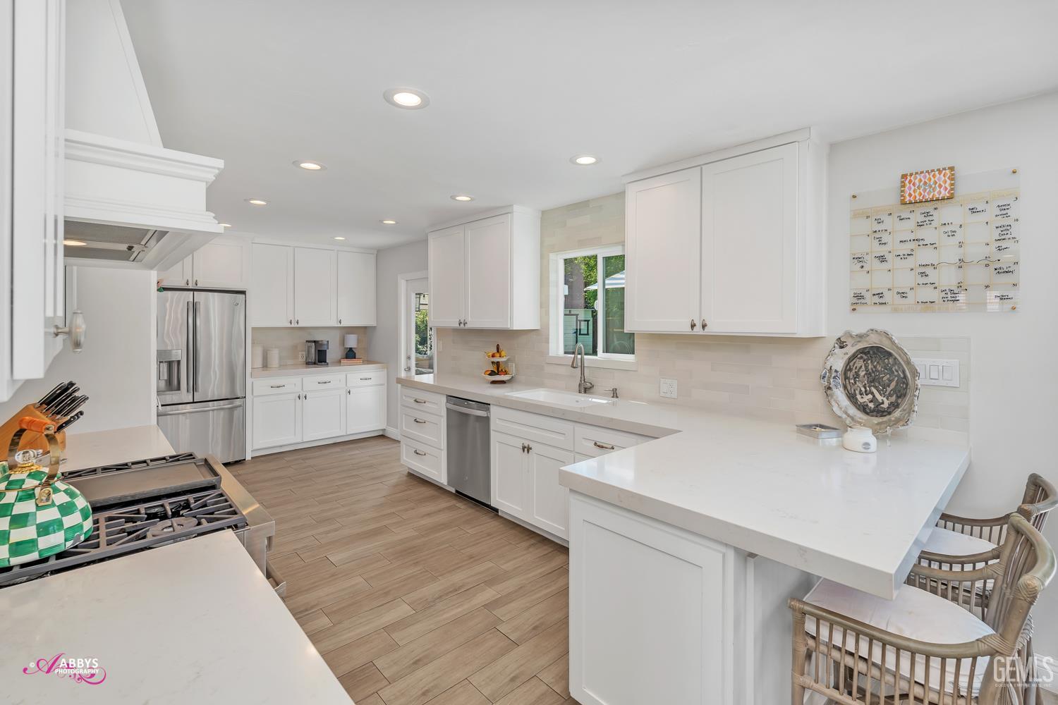 Undisclosed Address Bakersfield, CA 93309 - Photo 8 of 30 a kitchen with a sink appliances and cabinets