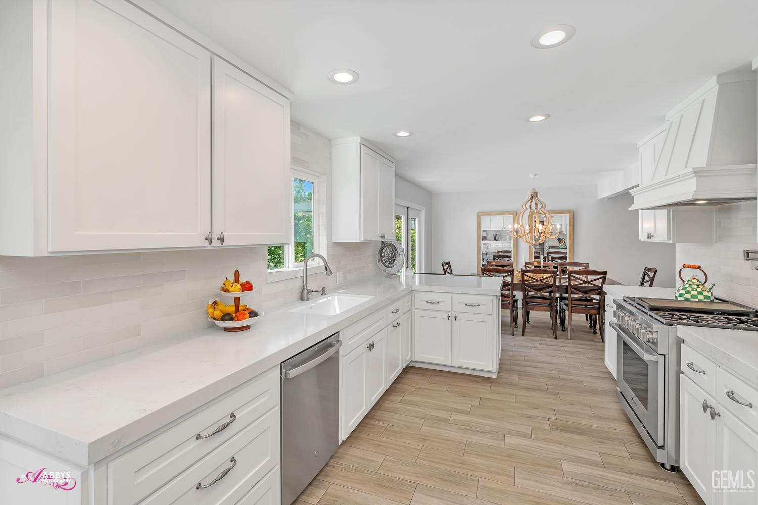 Undisclosed Address Bakersfield, CA 93309 - Photo 9 of 30 a kitchen with a sink and cabinets