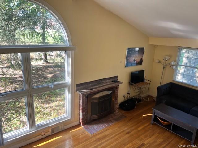 16 Lilac Road Westhampton Beach, NY 11978 - Photo 11 of 25 a living room with furniture and a fireplace