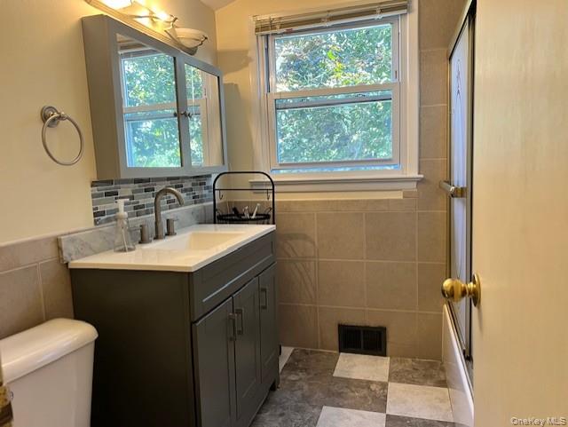 16 Lilac Road Westhampton Beach, NY 11978 - Photo 16 of 25 a bathroom with a sink and a mirror