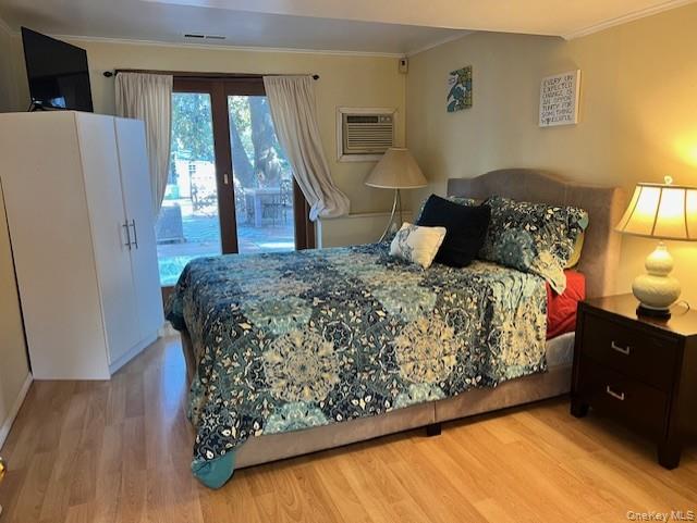 16 Lilac Road Westhampton Beach, NY 11978 - Photo 17 of 25 a bedroom with a bed dresser and a window