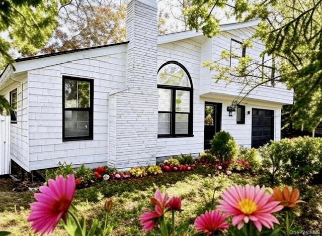 16 Lilac Road Westhampton Beach, NY 11978 - Photo 2 of 25 a front view of a house