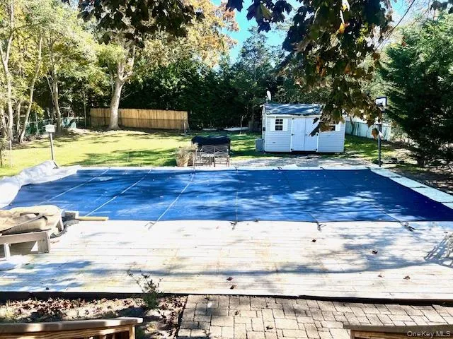a view of a swimming pool with a house