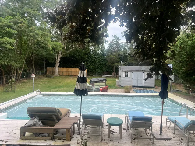 a view of a swimming pool with a patio
