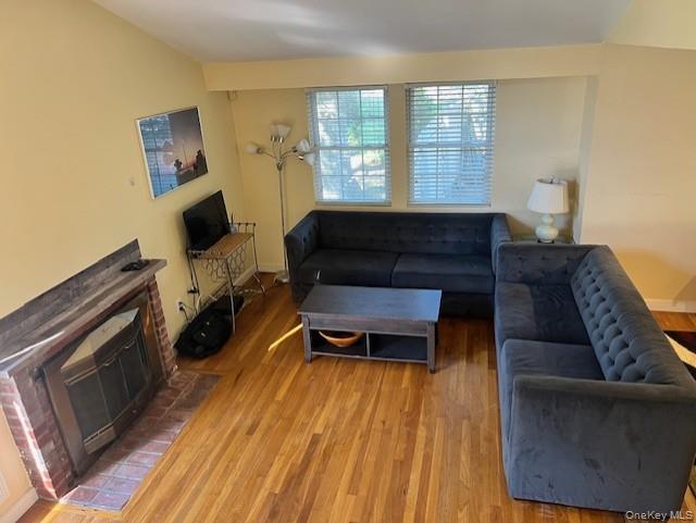16 Lilac Road Westhampton Beach, NY 11978 - Photo 10 of 25 a living room with furniture and a fireplace