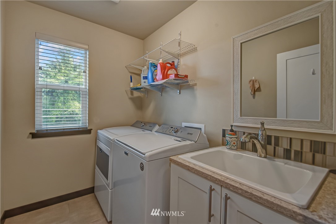 22810 23rd Avenue Southeast, Unit 2 Bothell, WA 98021 - Photo 16 of 16 a utility room with dryer and washer