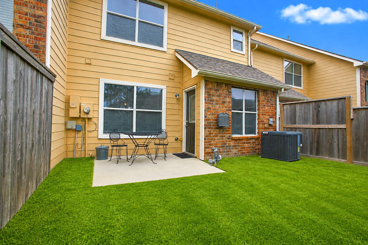 1618 Grable Cove Lane Spring, TX 77379 - Photo 27 of 32 Enjoy a quiet morning coffee or unwind in the evening on your private backyard patio overlooking the cozy green space.