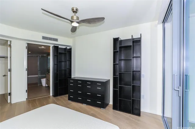 a bathroom with a granite countertop sink mirror and a bathtub