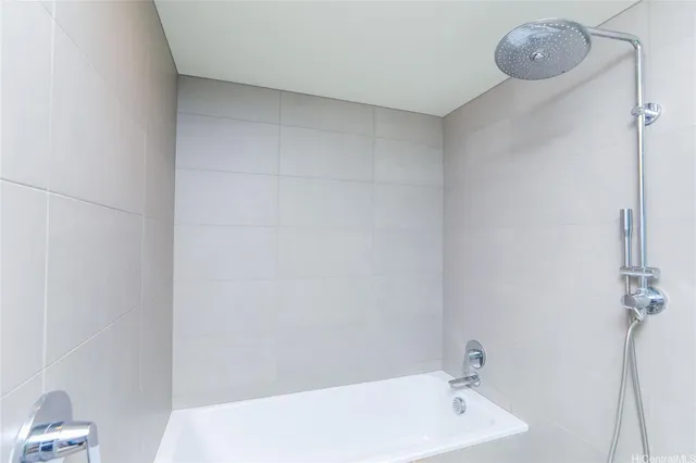 a bathroom with a sink a vanity and a large mirror