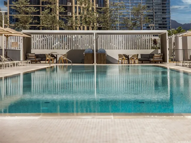 a view of a patio with dining table and chairs