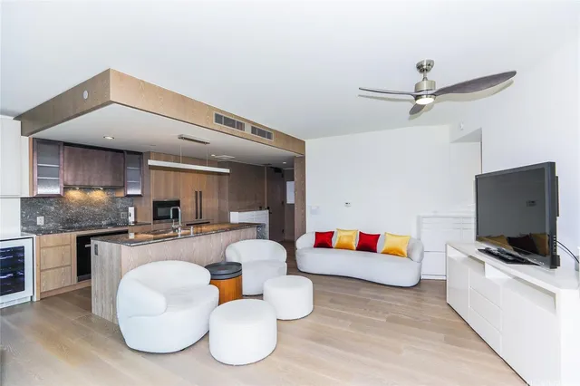 a living room with furniture and flat screen tv