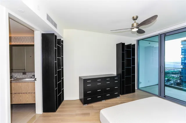 a bedroom with a bed and a dresser