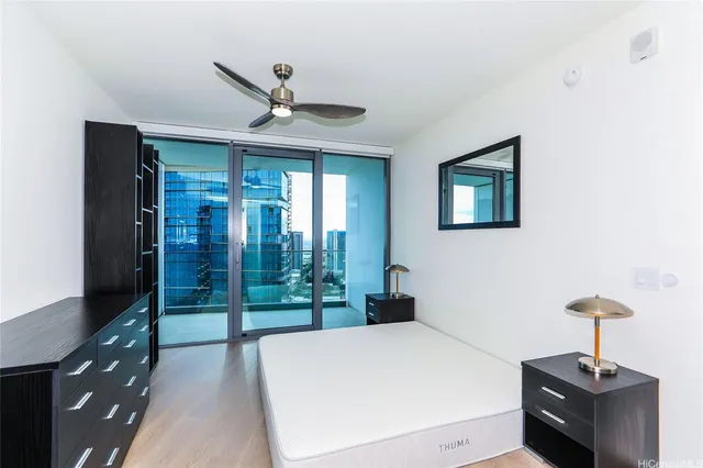 a bedroom with a bed and a table