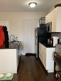 62 West Rutland Square, Unit 10 Boston, MA 02118 - Photo 3 of 6 a kitchen with a sink and a stove top oven