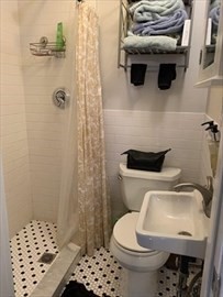 62 West Rutland Square, Unit 10 Boston, MA 02118 - Photo 5 of 6 a bathroom with a toilet a sink and shower