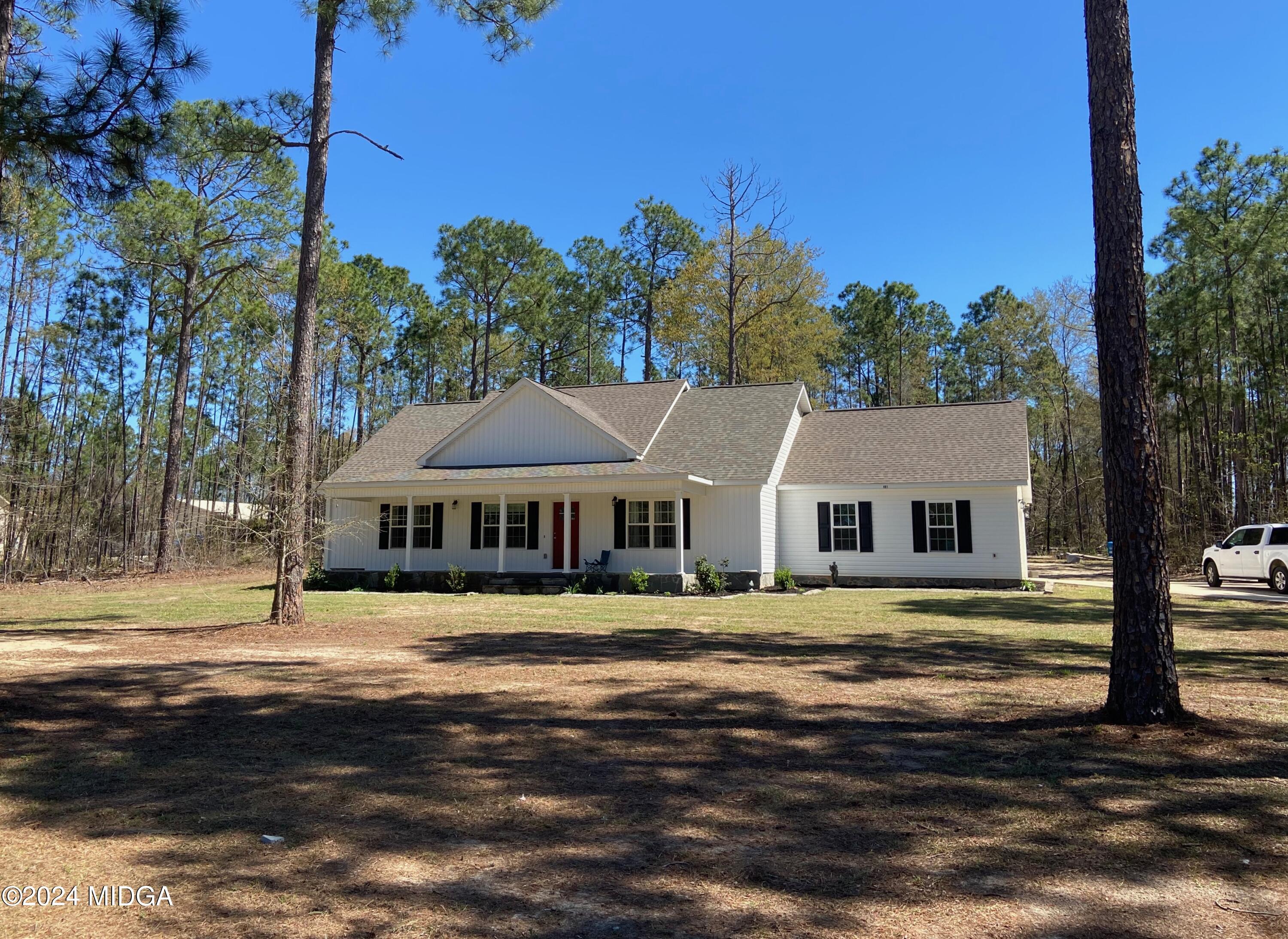 461 Schofill Road Fort Valley, GA 31030 - Photo 1 of 24 a front view of a house with a garden