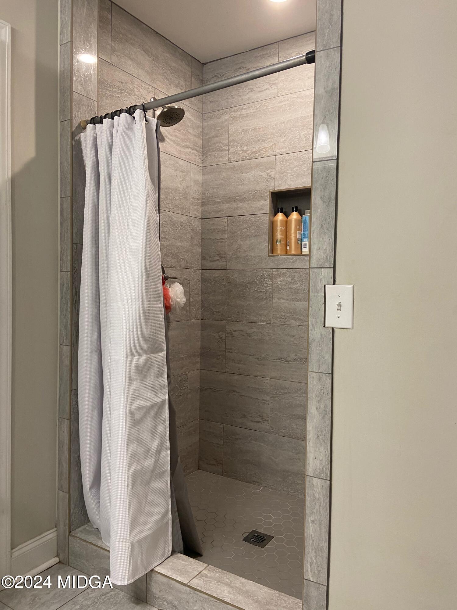 461 Schofill Road Fort Valley, GA 31030 - Photo 11 of 24 a bathroom with a shower and a sink
