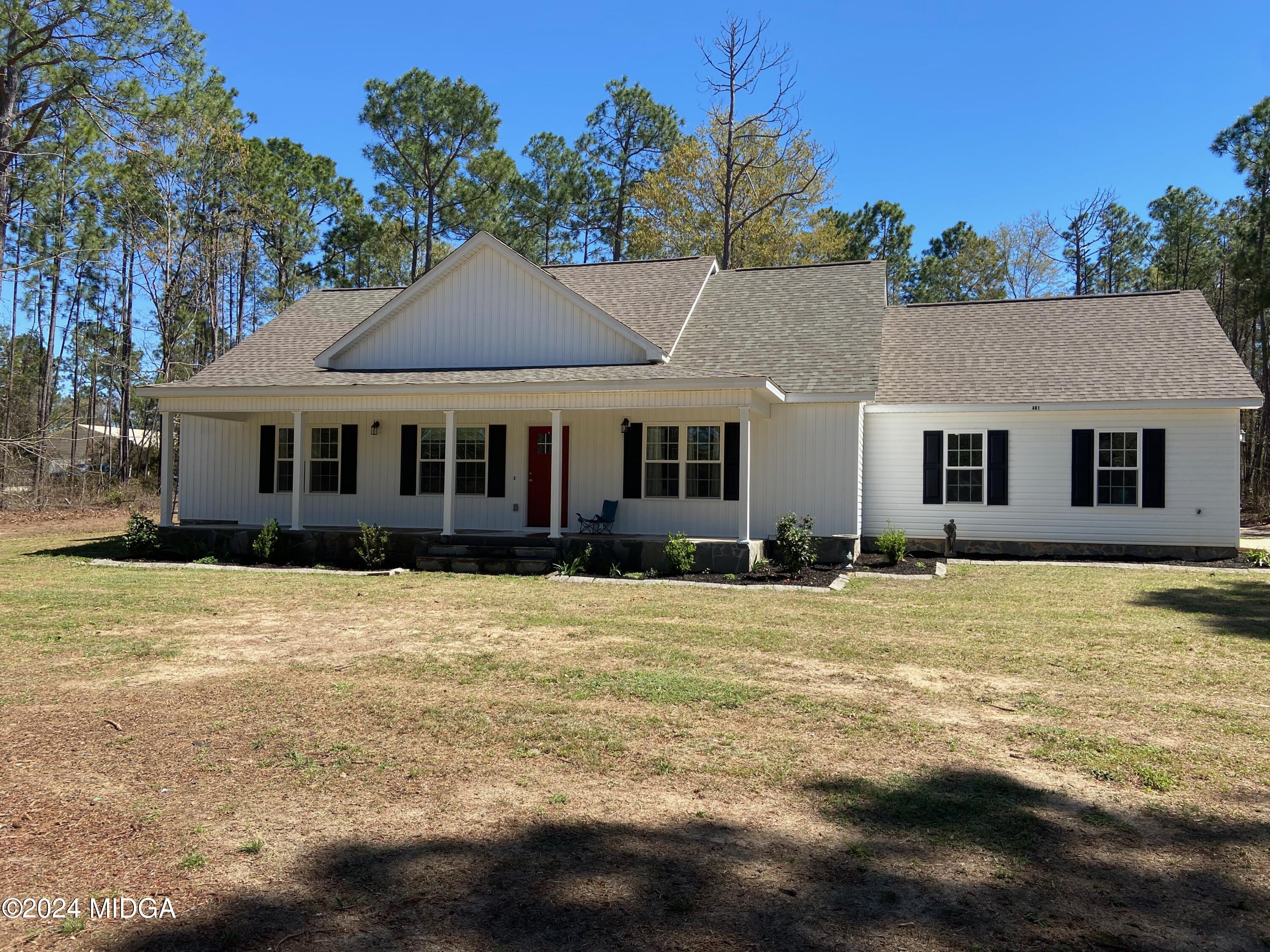 461 Schofill Road Fort Valley, GA 31030 - Photo 2 of 24 a front view of a house with a garden