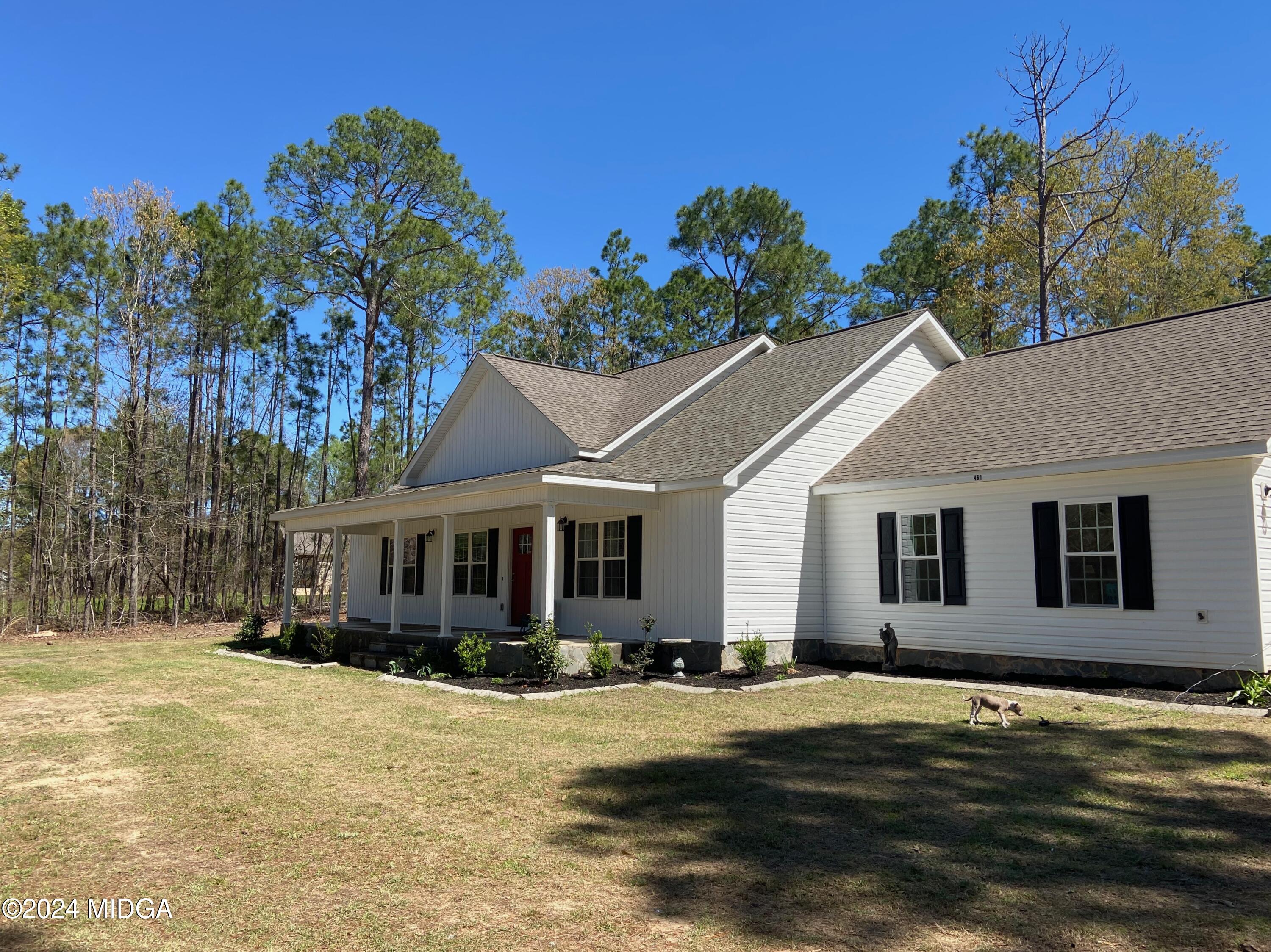 461 Schofill Road Fort Valley, GA 31030 - Photo 3 of 24 a front view of a house with a yard and garage
