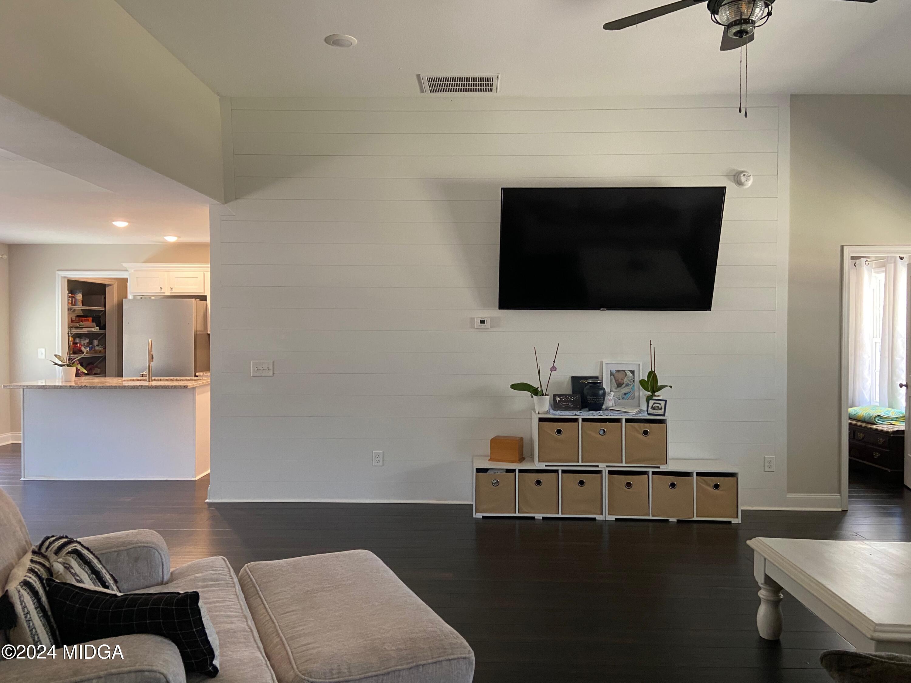 461 Schofill Road Fort Valley, GA 31030 - Photo 6 of 24 a living room with furniture and a flat screen tv
