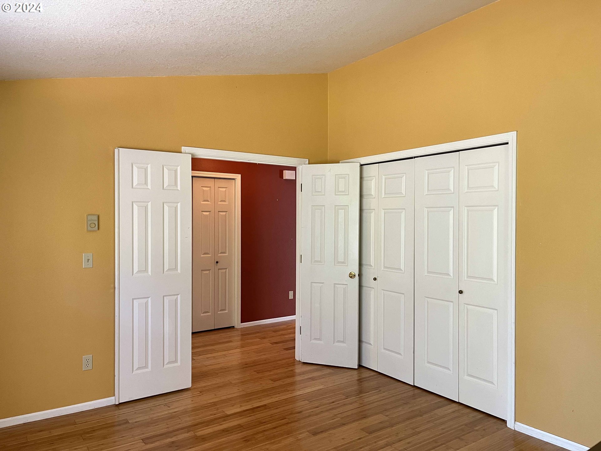 83480 Clear Lake Road Florence, OR 97439 - Photo 11 of 48 a view of an empty room with wooden floor