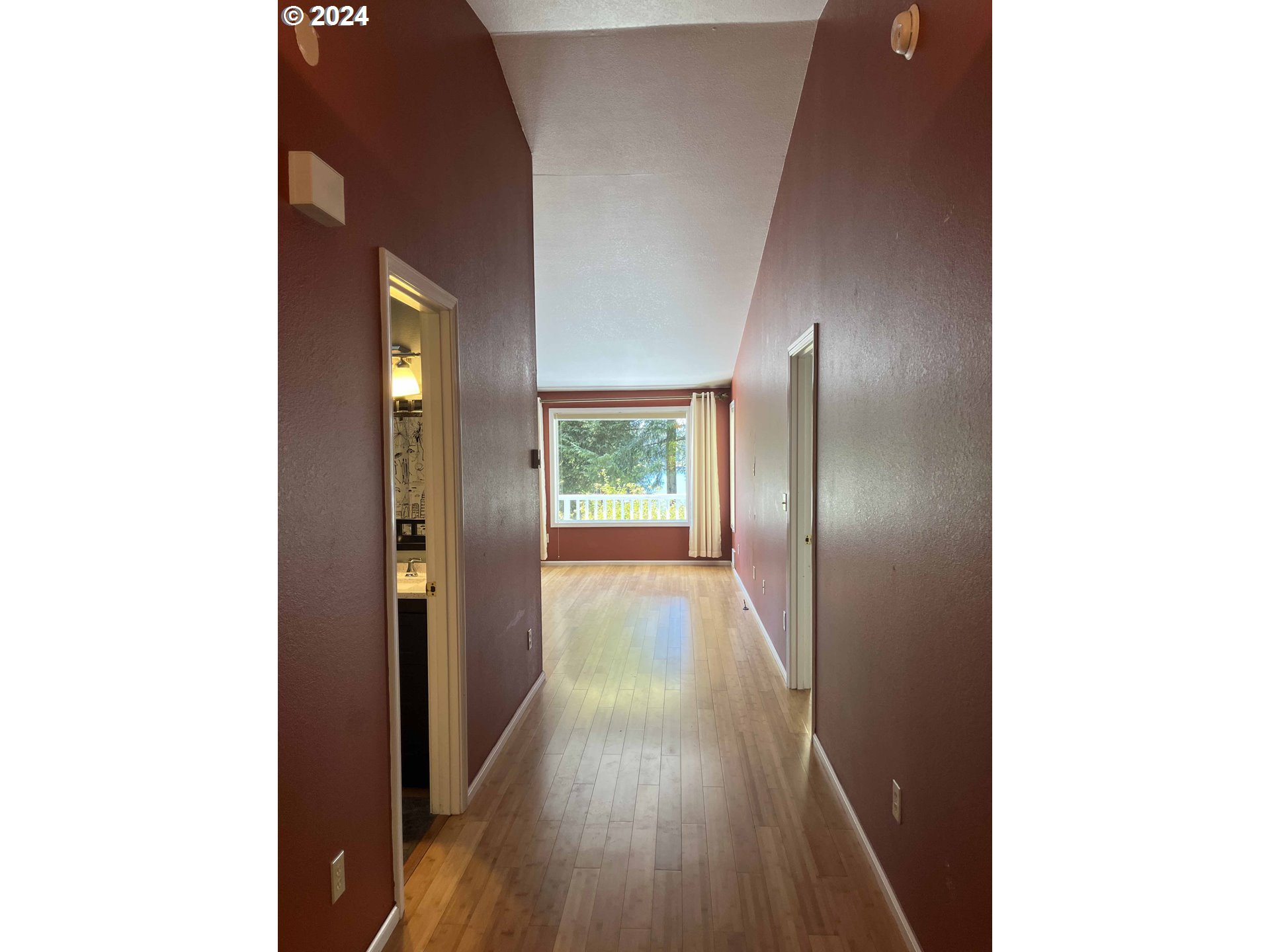 83480 Clear Lake Road Florence, OR 97439 - Photo 13 of 48 a view of a hallway with wooden floor