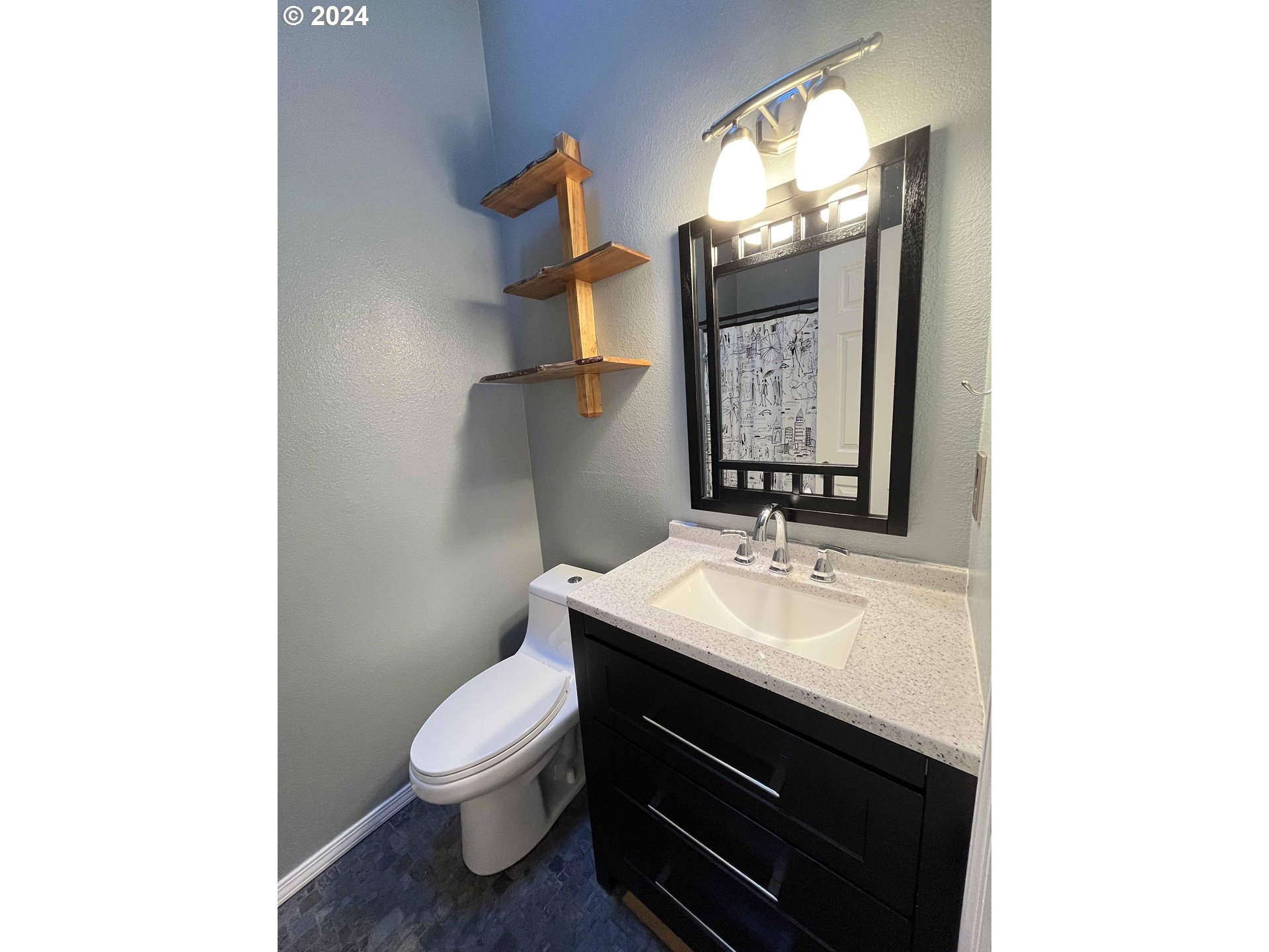 83480 Clear Lake Road Florence, OR 97439 - Photo 14 of 48 a bathroom with a toilet sink and mirror