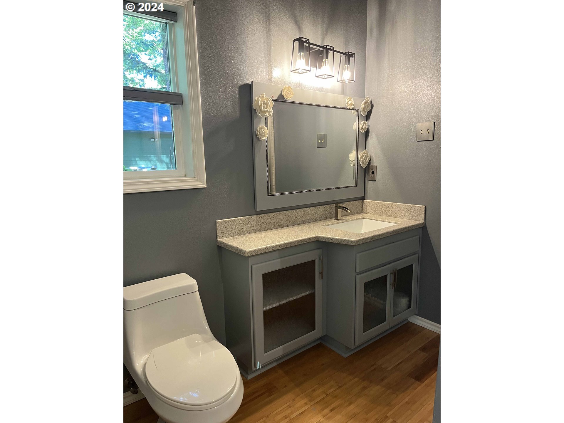 83480 Clear Lake Road Florence, OR 97439 - Photo 19 of 48 a bathroom with a toilet sink and mirror