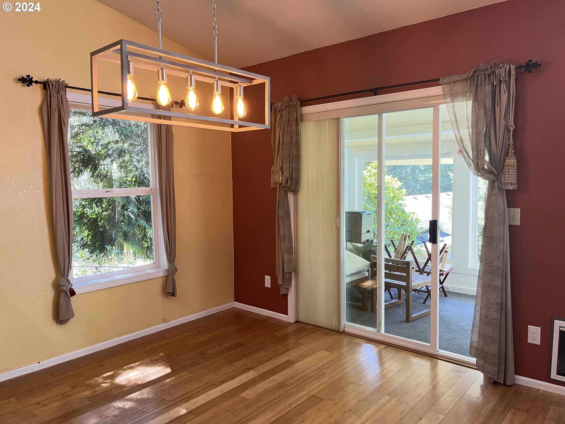 83480 Clear Lake Road Florence, OR 97439 - Photo 25 of 48 a view of an empty room with wooden floor and a window