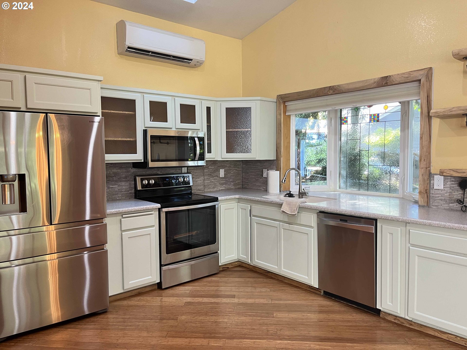83480 Clear Lake Road Florence, OR 97439 - Photo 26 of 48 a kitchen with stainless steel appliances a stove sink and microwave