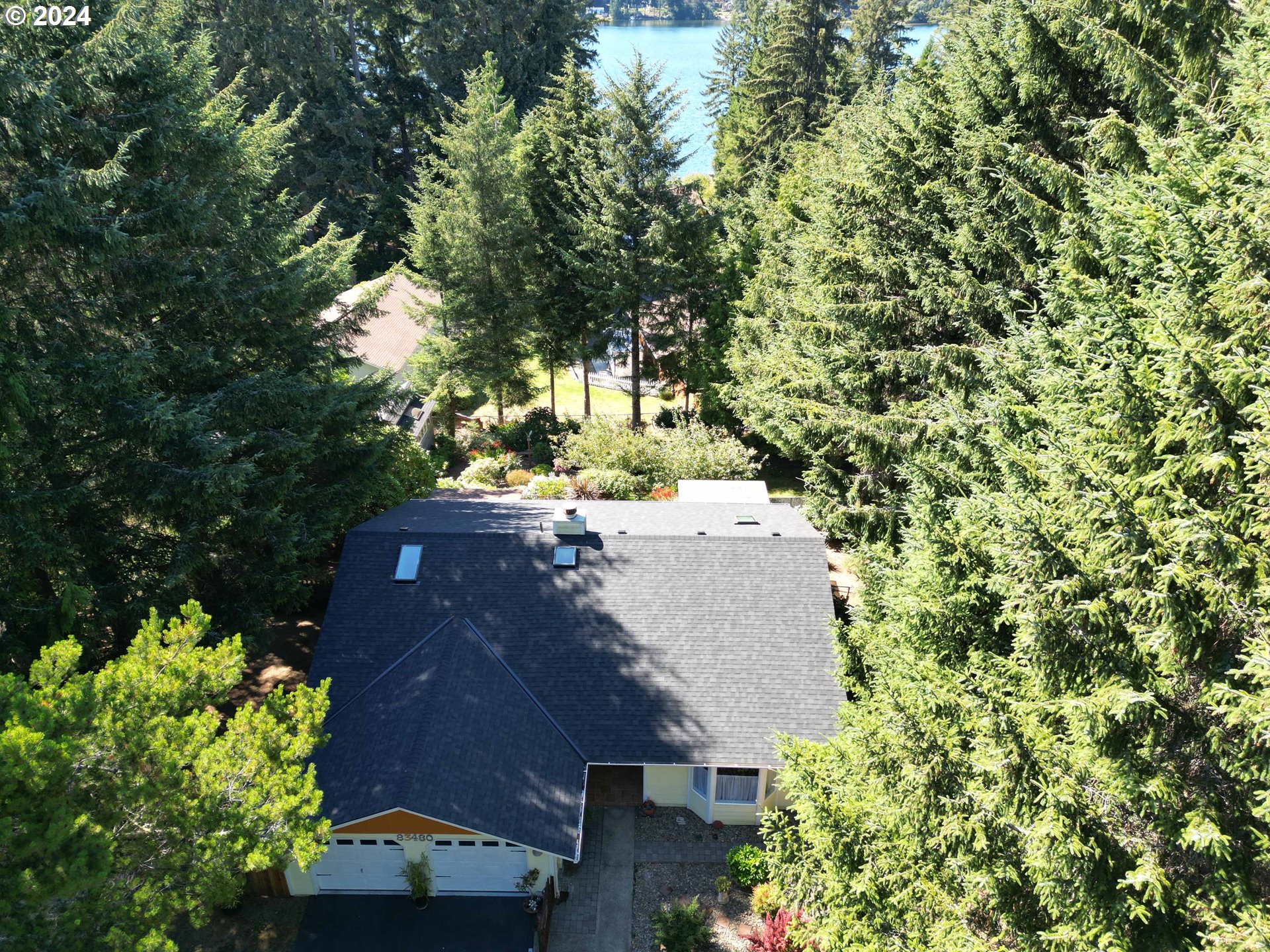 83480 Clear Lake Road Florence, OR 97439 - Photo 3 of 48 an aerial view of a house with a yard