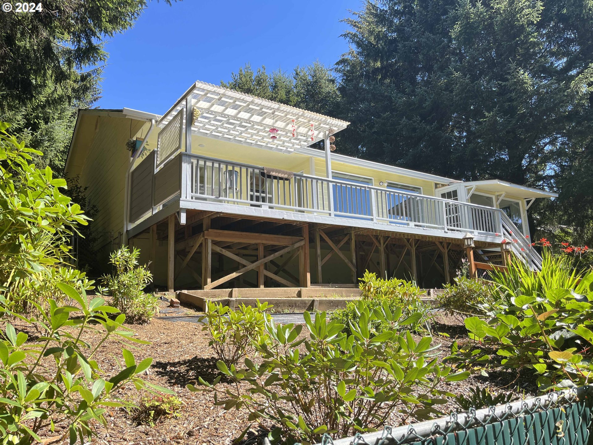 83480 Clear Lake Road Florence, OR 97439 - Photo 46 of 48 front view of a house with a small yard