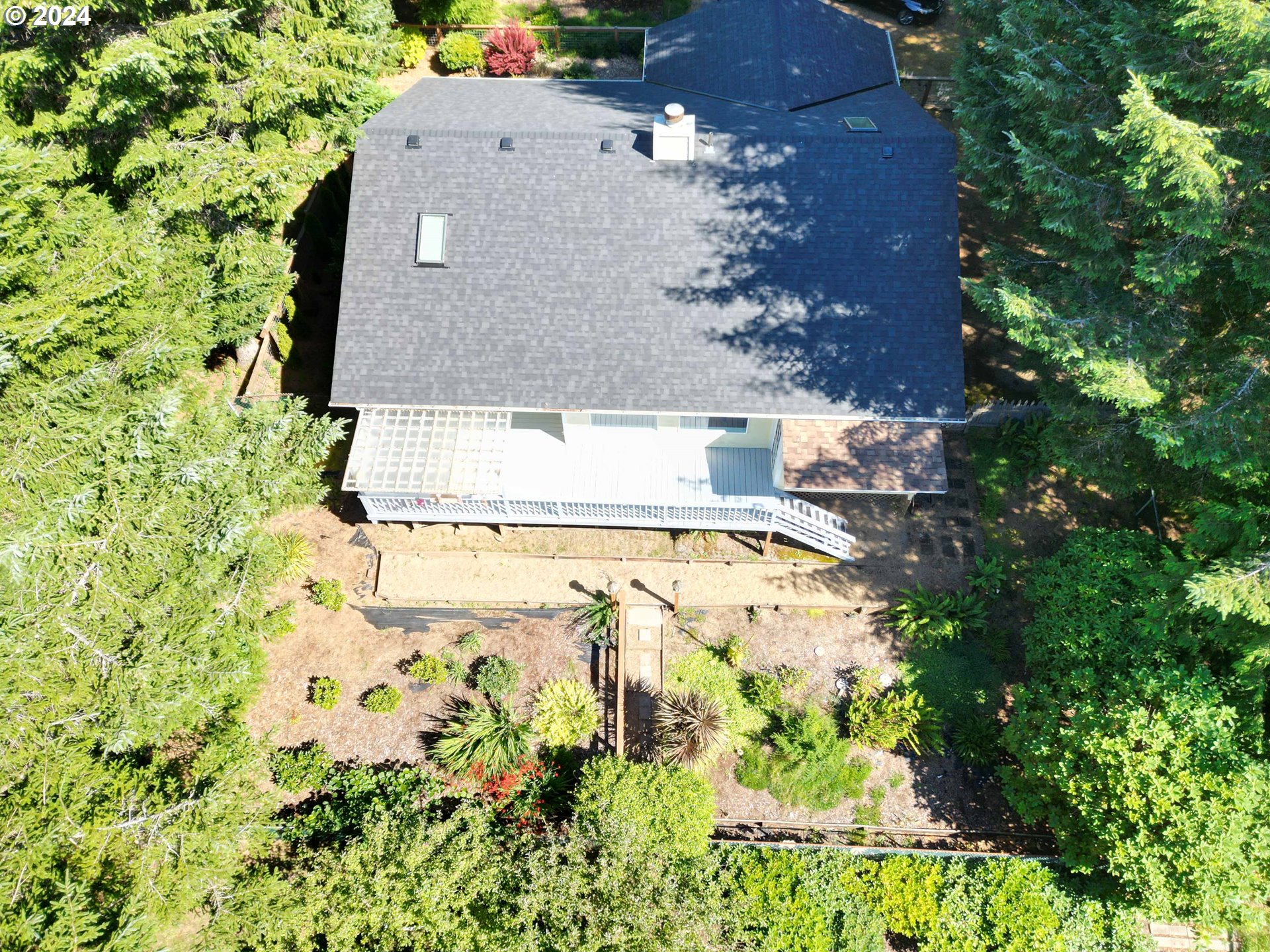 83480 Clear Lake Road Florence, OR 97439 - Photo 47 of 48 an aerial view of residential house with pool and garden