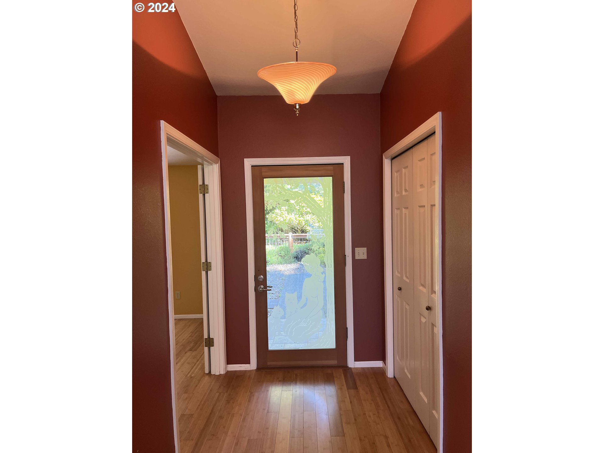 83480 Clear Lake Road Florence, OR 97439 - Photo 9 of 48 a view of a hallway with wooden floor