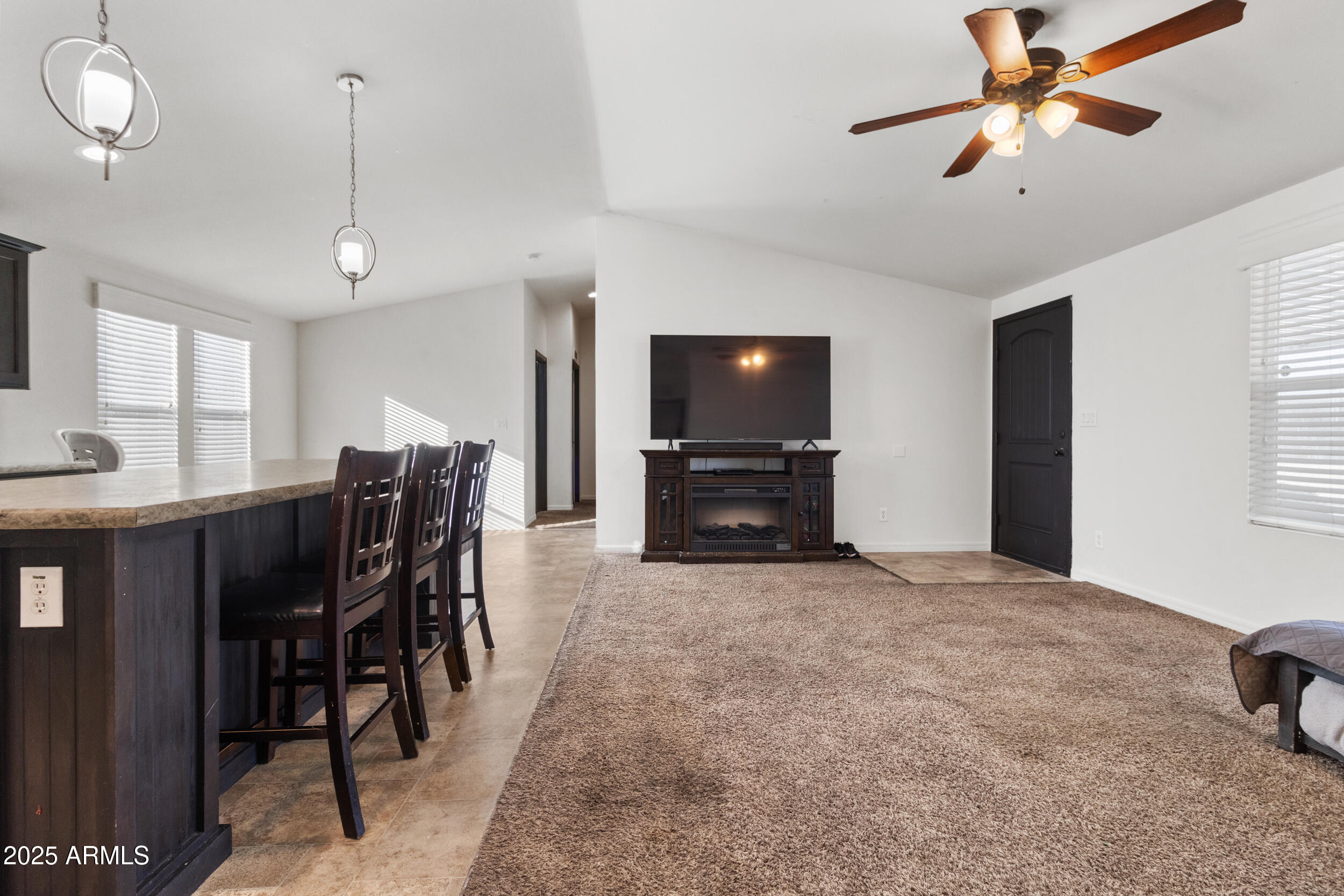 400 West Baseline Road, Unit 281 Tempe, AZ 85283 - Photo 12 of 54 a view of a livingroom with furniture and a flat screen tv