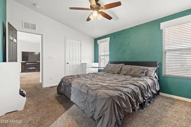 a bedroom with a bed and window