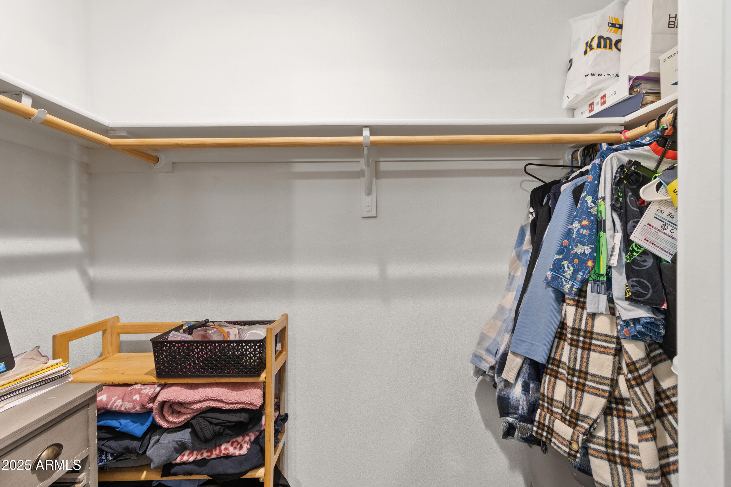 400 West Baseline Road, Unit 281 Tempe, AZ 85283 - Photo 22 of 54 a view of walk in closet with clothes and shoes