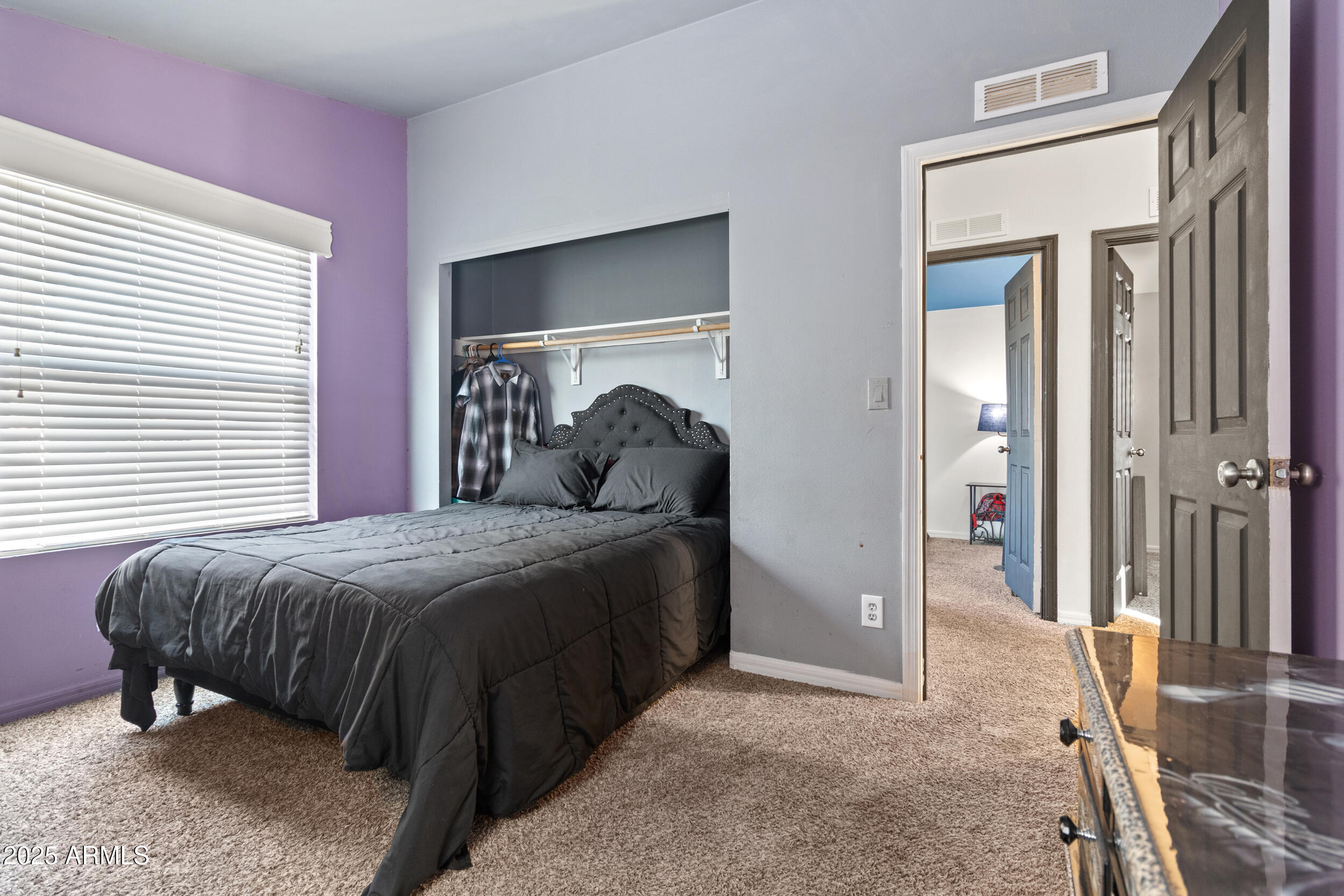 400 West Baseline Road, Unit 281 Tempe, AZ 85283 - Photo 28 of 54 a bedroom with a bed and a mirror