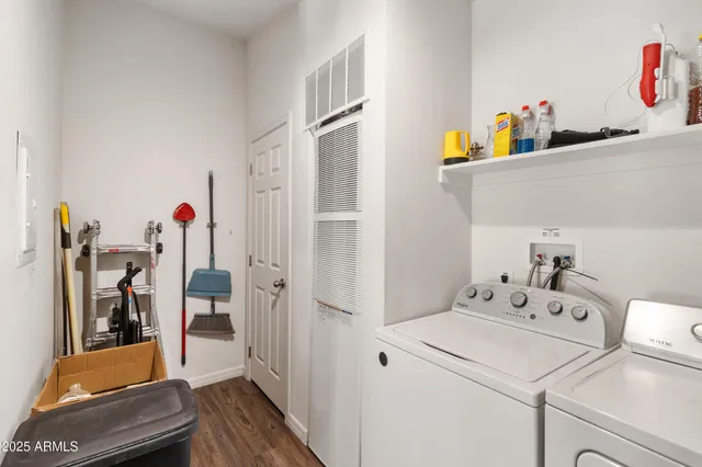 a view of a white house with a yard