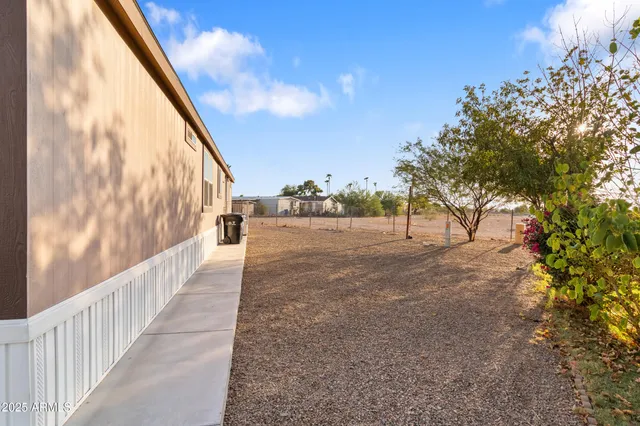 a view of a house with backyard and porch