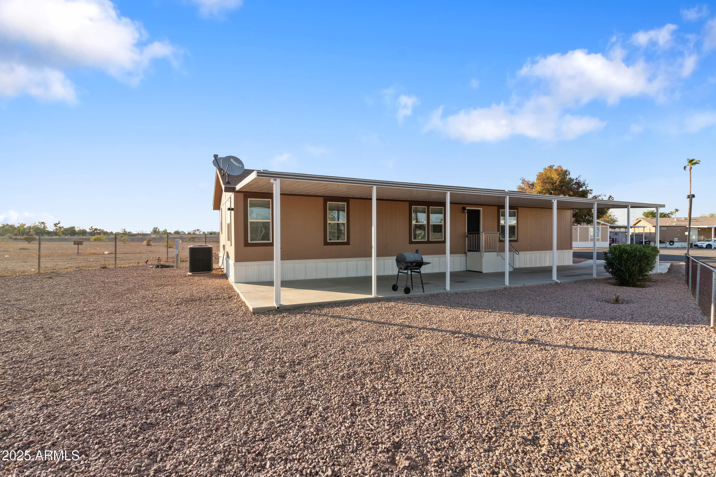 400 West Baseline Road, Unit 281 Tempe, AZ 85283 - Photo 39 of 54 a front view of a house with a yard