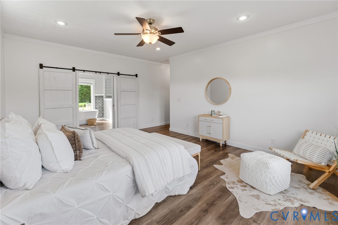 13110 Continental Road Wilsons, VA 23894 - Photo 22 of 35 Wood-finish flooring throughout, white walls, rece
