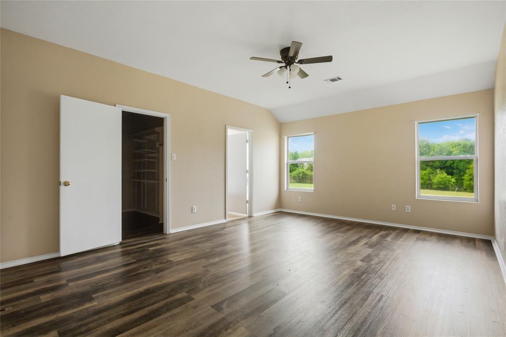 100 Pinnacle Circle Aledo, TX 76008 - Photo 14 of 30 a view of an empty room with wooden floor and a window