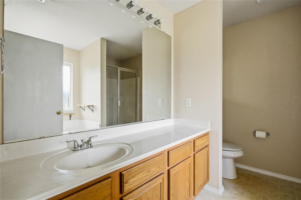 100 Pinnacle Circle Aledo, TX 76008 - Photo 16 of 30 a bathroom with a sink a toilet and shower