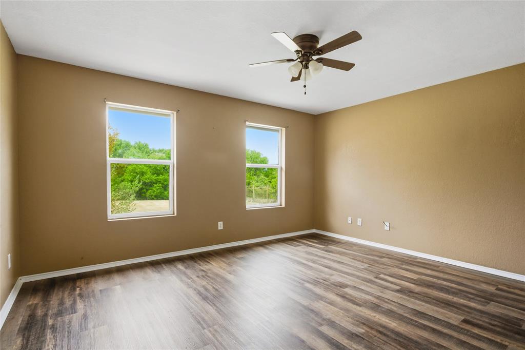100 Pinnacle Circle Aledo, TX 76008 - Photo 20 of 30 a view of room with window ceiling fan and hardwood floor