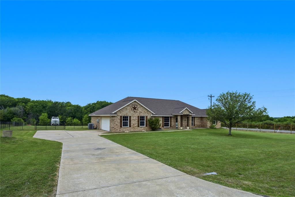 100 Pinnacle Circle Aledo, TX 76008 - Photo 3 of 30 a view of house with garden and trees