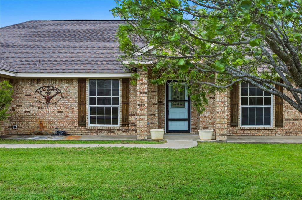 100 Pinnacle Circle Aledo, TX 76008 - Photo 4 of 30 front view of a house with a yard