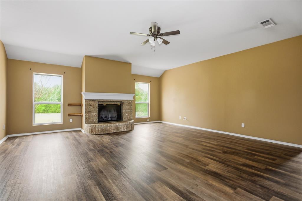 100 Pinnacle Circle Aledo, TX 76008 - Photo 8 of 30 a view of an empty room with a fireplace and a window