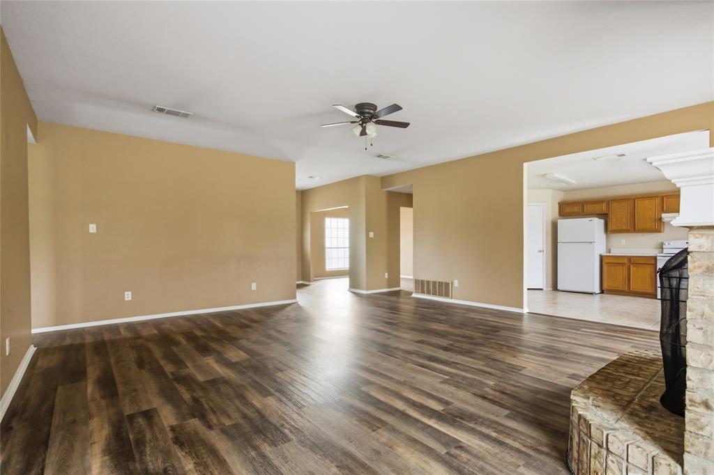 100 Pinnacle Circle Aledo, TX 76008 - Photo 9 of 30 a view of an empty room with window and wooden floor